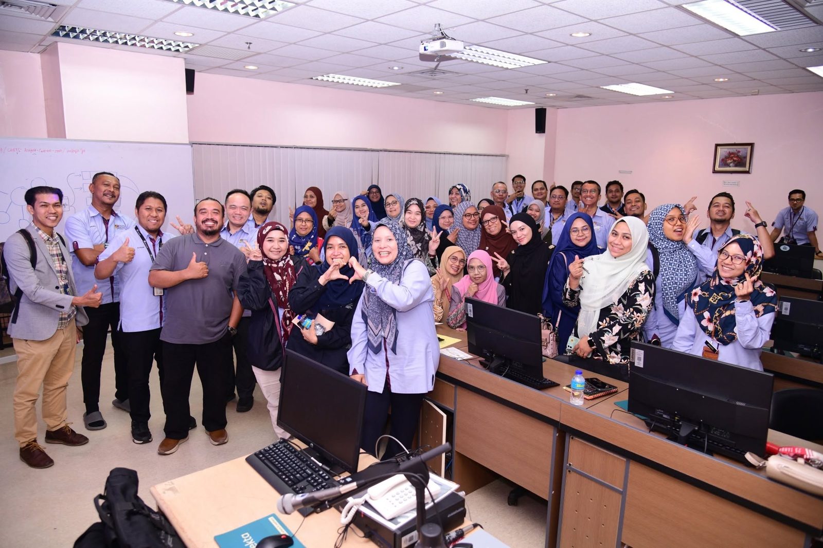 Norzaful with a large group of HCTM staff in the computer lab
