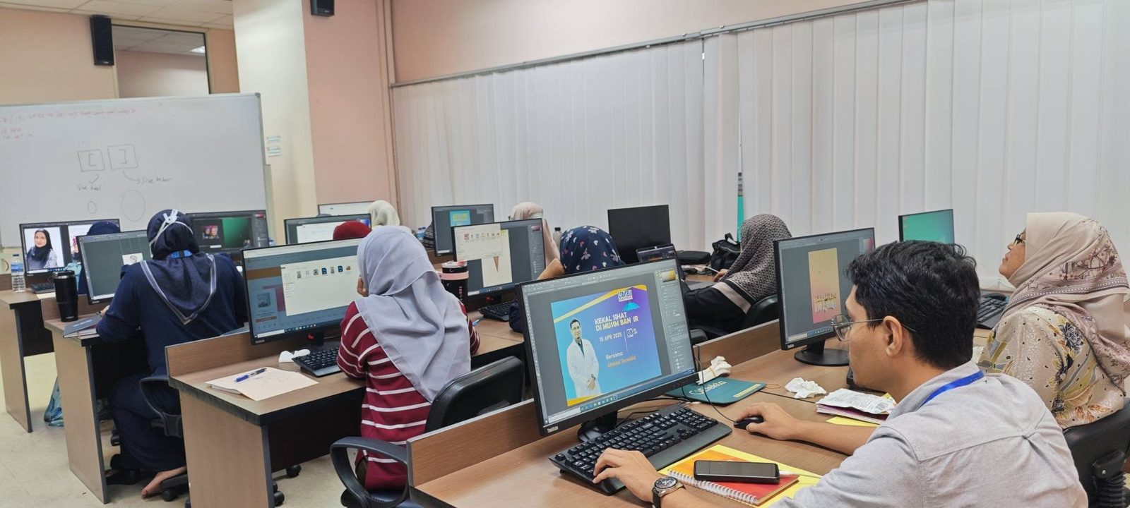 Computer lab full of participants working in Photoshop