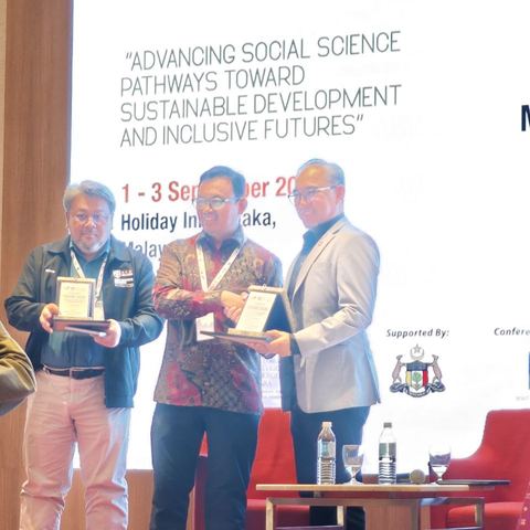 Plaque presentation on stage at the CASSIC 2026 opening ceremony