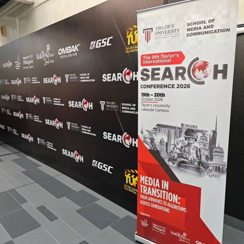 SEARCH Conference 2026 roll-up banner beside the event backdrop
