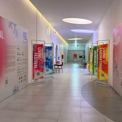 Corridor lined with Living Festival and VFCD 2026 banners